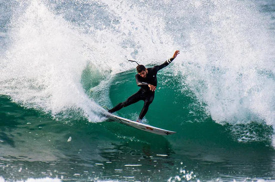 Filipe surfing a big wave.